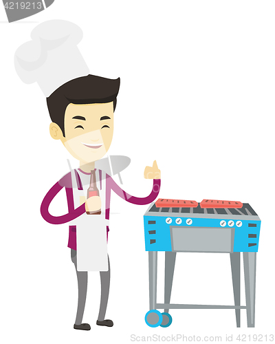 Image of Man cooking steak on barbecue grill.