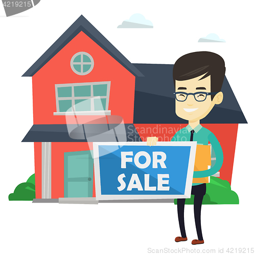 Image of Young asian realtor offering house.