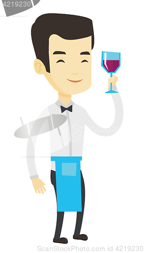 Image of Bartender holding a glass of wine in hand.