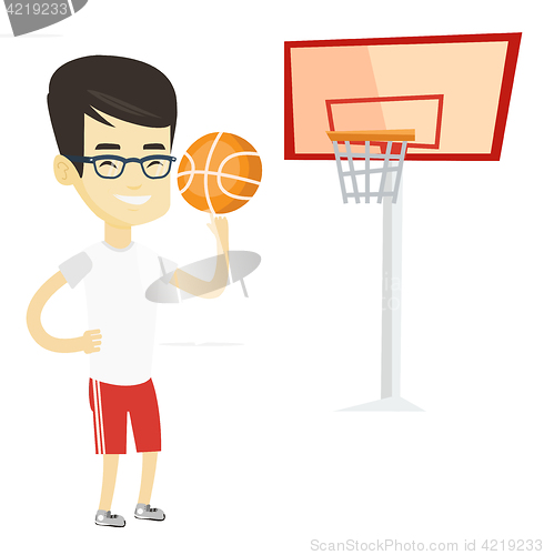 Image of Young basketball player spinning ball.