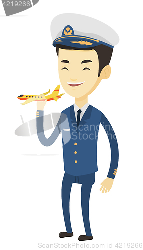 Image of Cheerful airplane pilot with model of airplane.