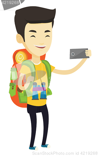 Image of Man with backpack making selfie.