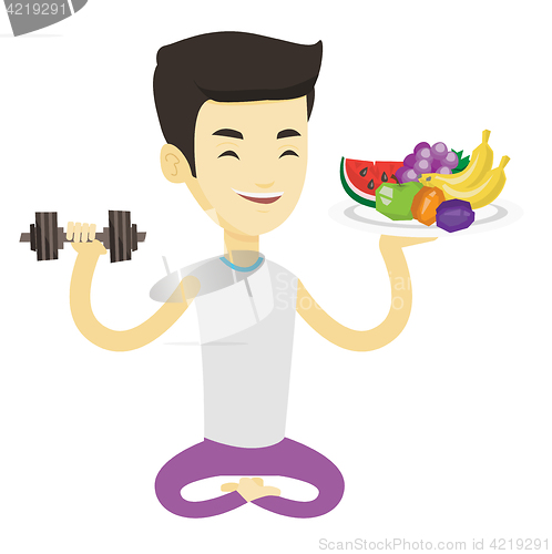 Image of Healthy man with fruits and dumbbell.