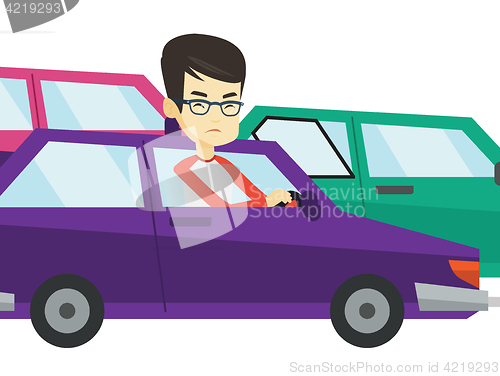 Image of Angry asian man in car stuck in traffic jam.