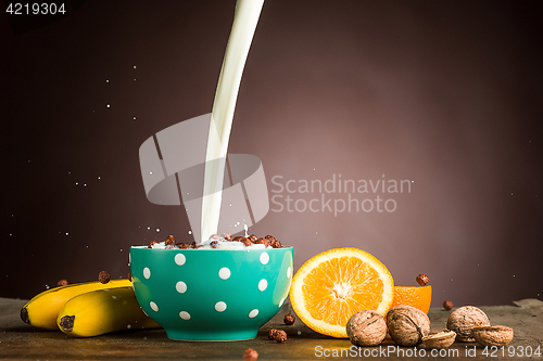 Image of Healthy home made breakfast of muesli, apples, fresh fruits and walnuts