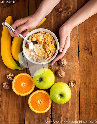 Image of Healthy home made breakfast of muesli, apples, fresh fruits and walnuts