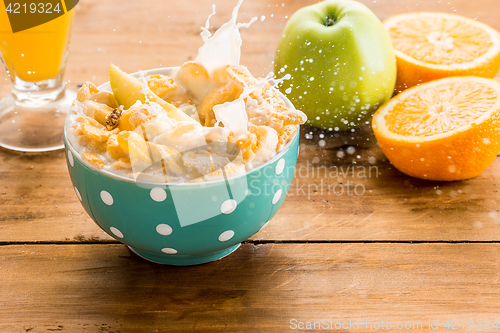 Image of Healthy home made breakfast of muesli, apples, fresh fruits and walnuts