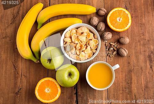 Image of Healthy home made breakfast of muesli, apples, fresh fruits and walnuts