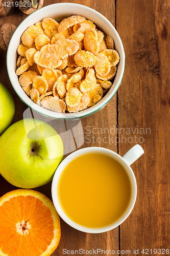 Image of Healthy home made breakfast of muesli, apples, fresh fruits and walnuts