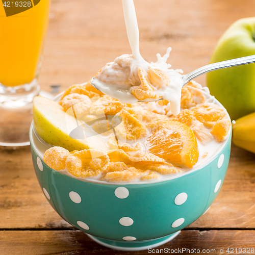 Image of Healthy home made breakfast of muesli, apples, fresh fruits and walnuts