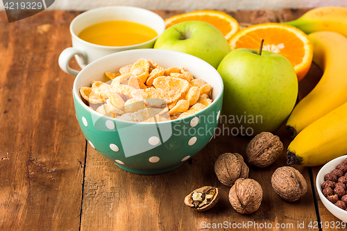 Image of Healthy home made breakfast of muesli, apples, fresh fruits and walnuts