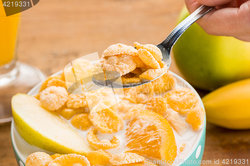 Image of Healthy home made breakfast of muesli, apples, fresh fruits and walnuts