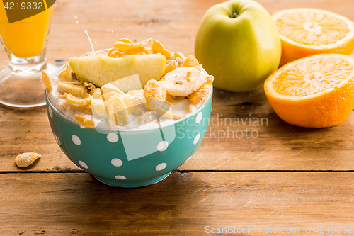 Image of Healthy home made breakfast of muesli, apples, fresh fruits and walnuts