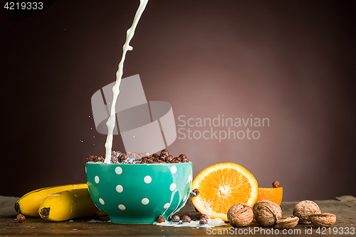 Image of Healthy home made breakfast of muesli, apples, fresh fruits and walnuts