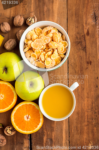 Image of Healthy home made breakfast of muesli, apples, fresh fruits and walnuts