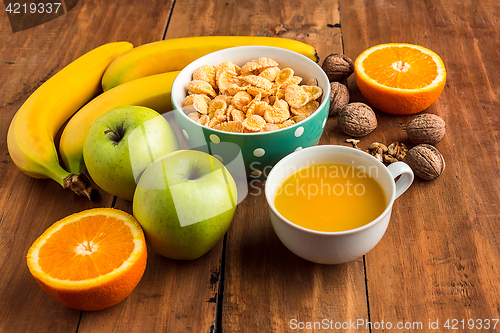 Image of Healthy home made breakfast of muesli, apples, fresh fruits and walnuts