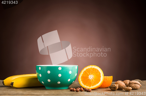 Image of Healthy home made breakfast of muesli, apples, fresh fruits and walnuts