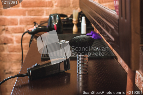 Image of Barber shop equipment on wooden background.