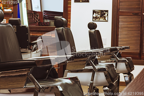 Image of Vintage chairs in barbershop