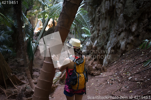 Image of Brunette in hat with backpack