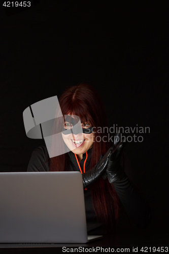 Image of Female hacker in black mask