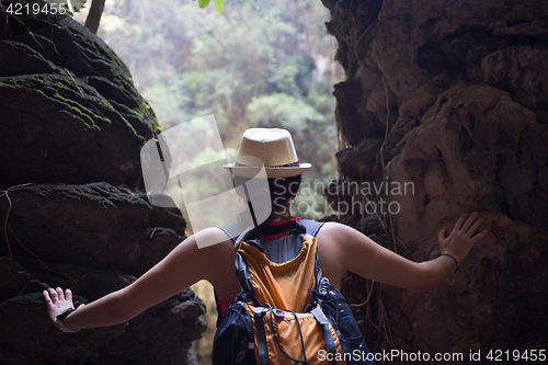 Image of Woman among hills in rainforest