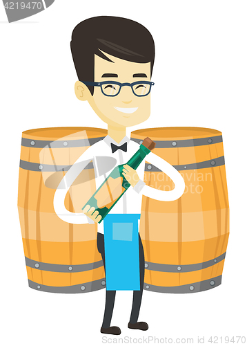 Image of Waiter holding bottle of alcohol.