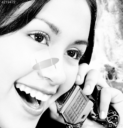 Image of Girl Talking On The Phone And Standing Outside