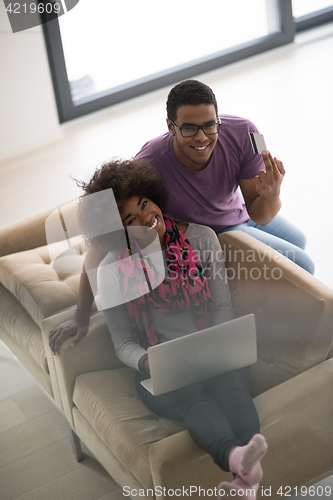 Image of african american couple shopping online