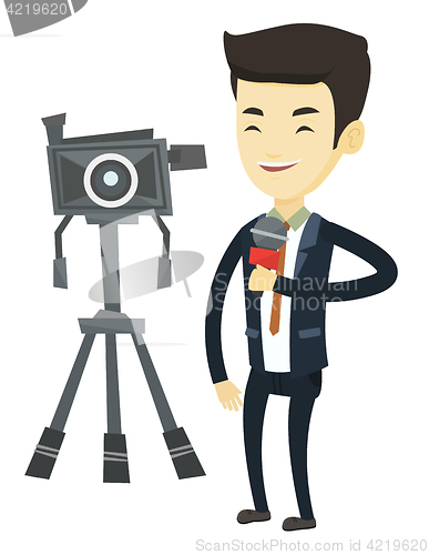 Image of TV reporter with microphone and camera.