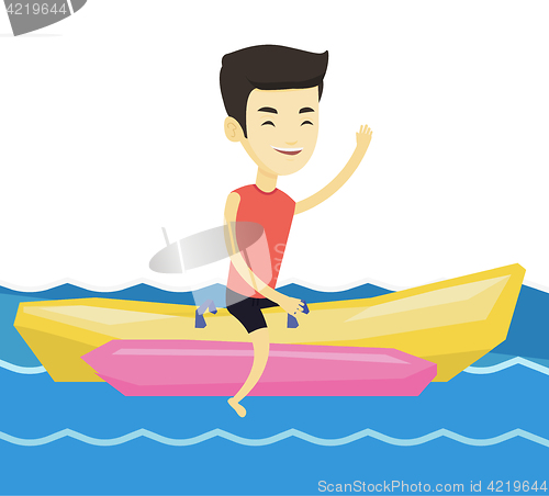 Image of Tourists riding a banana boat vector illustration.