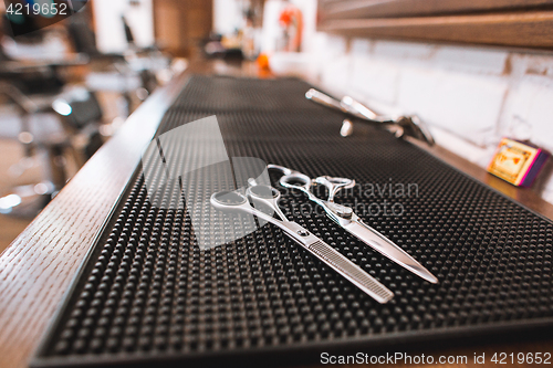 Image of Barber shop equipment on wooden background.