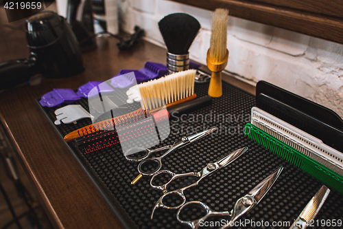 Image of Barber shop equipment on wooden background.