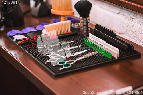 Image of Barber shop equipment on wooden background.