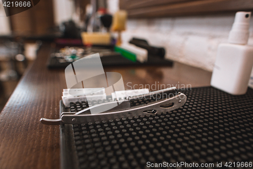 Image of Barber shop equipment on wooden background.