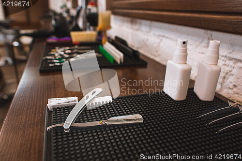 Image of Barber shop equipment on wooden background.