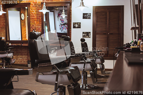 Image of Vintage chairs in barbershop