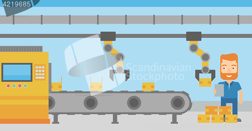 Image of Robotic arm working on production line.