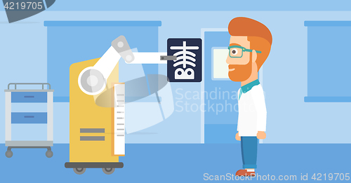 Image of Doctor examining radiograph with help of robot.