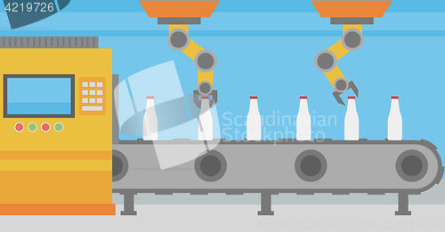 Image of Robotic arm working on conveyor belt with bottles.