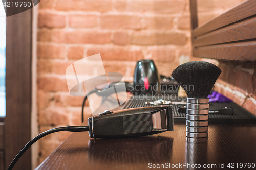 Image of Barber shop equipment on wooden background.