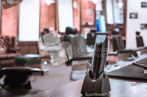 Image of Barber shop equipment on wooden background.