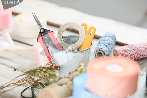 Image of The florist desktop with working tools on white background