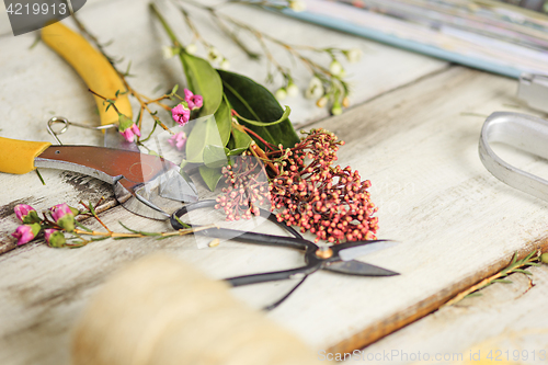 Image of The florist desktop with working tools on white background