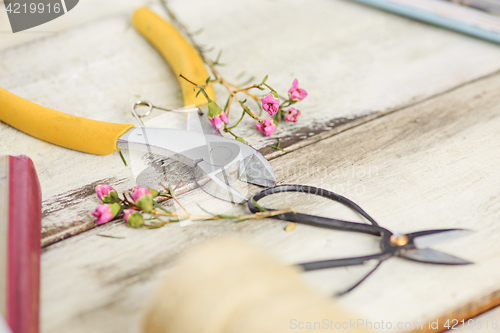 Image of The florist desktop with working tools on white background