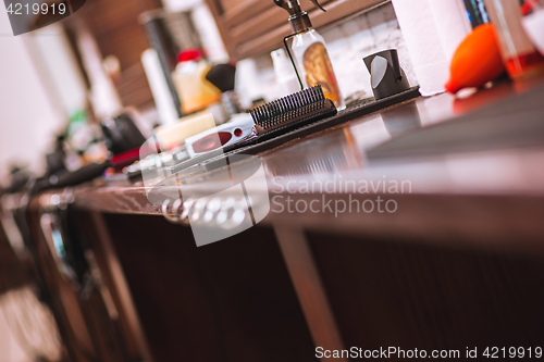 Image of Barber shop equipment on wooden background.