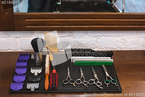Image of Barber shop equipment on wooden background.