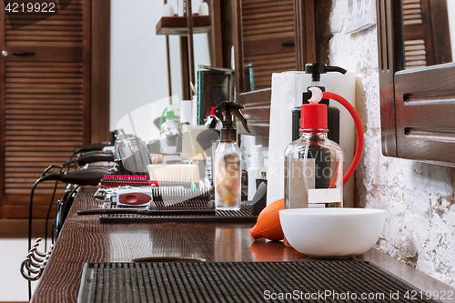 Image of Barber shop equipment on wooden background.