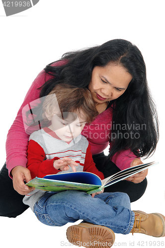 Image of Nanny read book to little boy.  