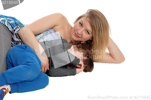 Image of Mother and son lying on floor.
